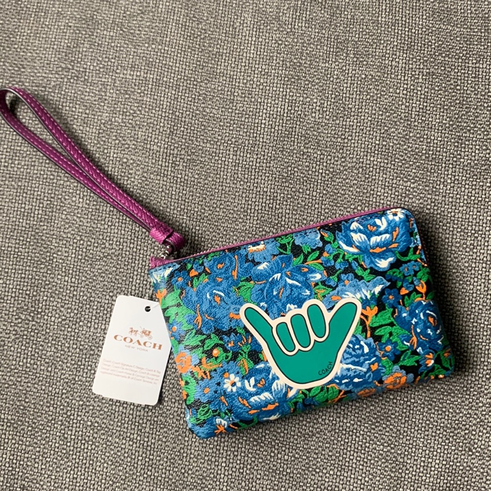 NWT Coach leather wristlet with zip closure.